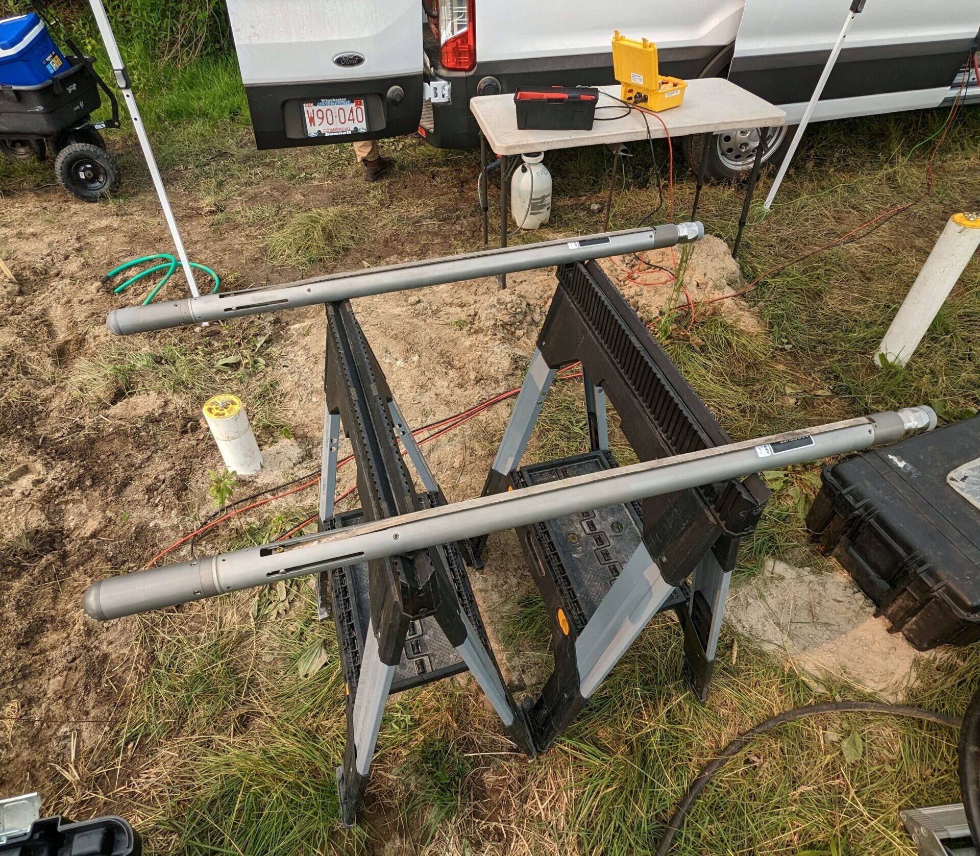 Three-component tri-axial borehole geophones (Model BHG-3 by Geostuff). The geophones are equipped with a fluxgate compass and servo mechanism which automatically orients the horizontal geophones to any magnetic azimuth selected by the operator. The clamping mechanism is a steel leaf spring, compressed by a motor-driven piston. When compressed, the spring expands, forcing the geophone against the borehole wall. (Collier Geophysics)